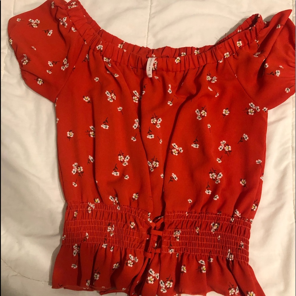 red, off the shoulder blouse.
